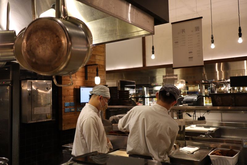 GYG kitchen team preparing fresh food